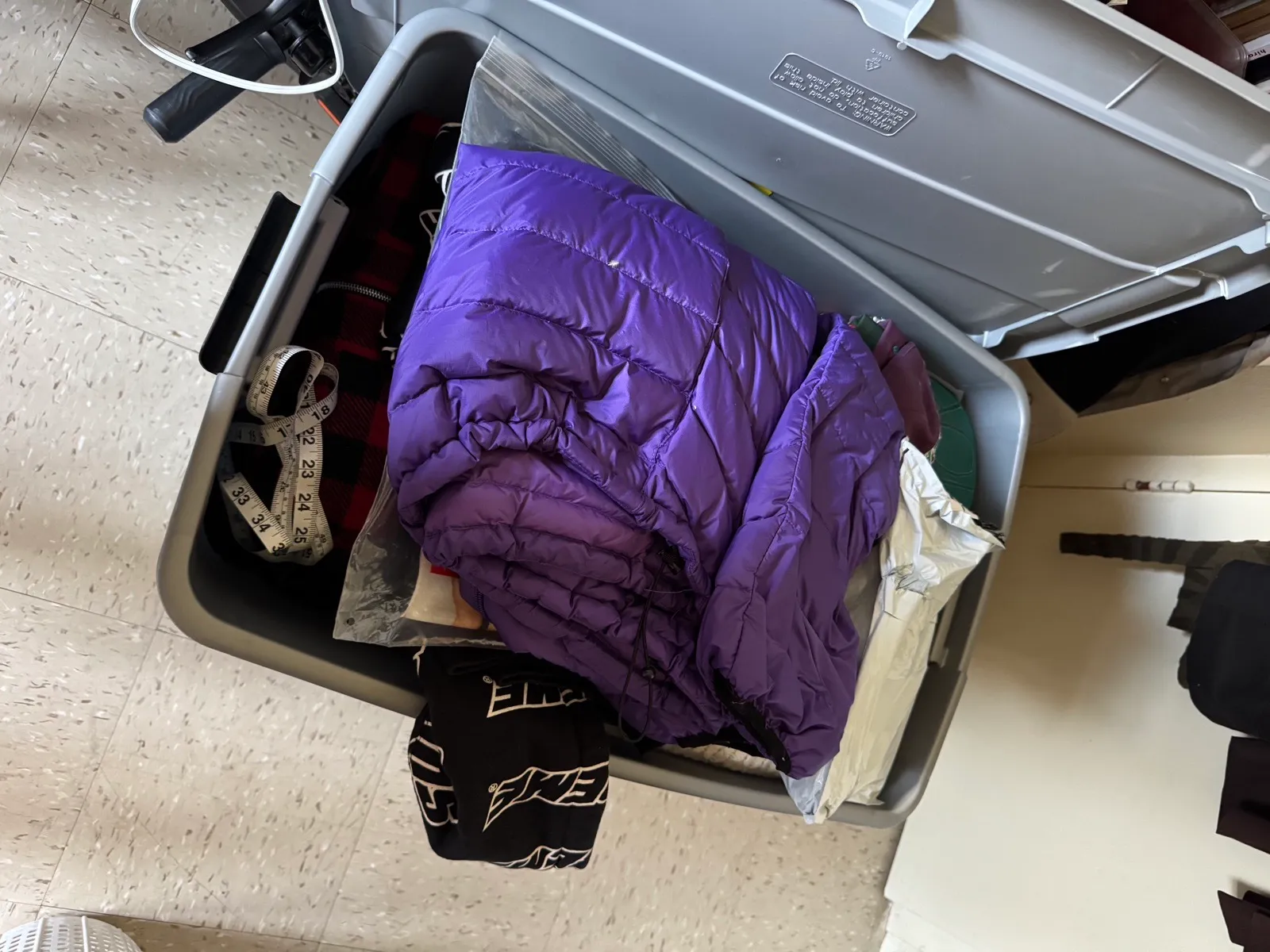 A sorting bin — vintage Supreme among the keep-or-sell decisions.